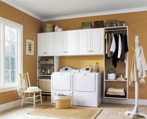 Closet Solutions custom build cabinets, counter top and storage for laundry and cleaning.