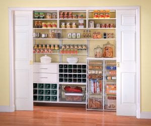 Pantry organization with baskets and shelving, wine rack and open cabinets.